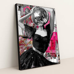This artwork features a striking figure in a lace black dress with a disco ball for a head, set against a vibrant abstract pink collage, displayed in a black frame.