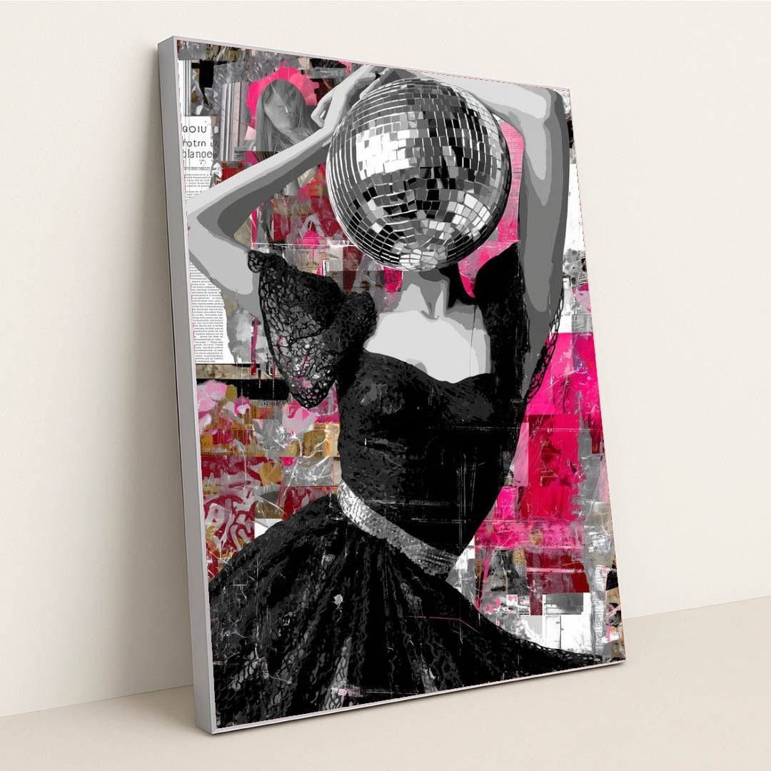This artwork features a striking figure in a lace black dress with a disco ball for a head, set against a vibrant abstract pink collage, displayed in a silver frame.