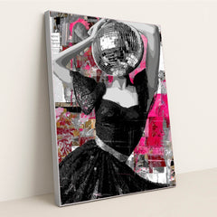 This artwork features a striking figure in a lace black dress with a disco ball for a head, set against a vibrant abstract pink collage, displayed in a silver frame.