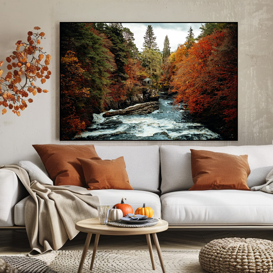 Living room with a large wall art depicting a forest scene with a river, surrounded by autumn-themed decor.