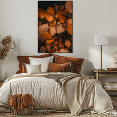 Cozy bedroom with a bed, decorative pillows, and a wall art piece.