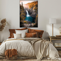 Bedroom with a large bed featuring brown and white bedding, a lamp on a nightstand, and a scenic wall art of a waterfall.