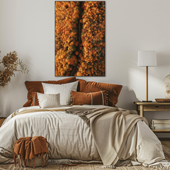 Cozy bedroom with a bed, decorative pillows, and a large abstract painting on the wall.
