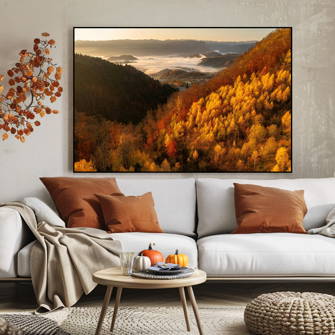 Living room with a large framed autumn landscape, white sofa with brown and beige pillows, and a small round table.