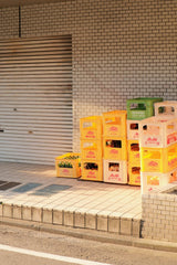 Mak - A bunch of boxes sitting on the side of a road photo