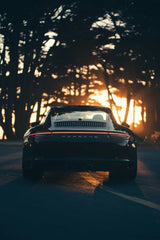Porsche 911 Carrera 4s at Golden Hour, a black car parked with sunset glow, perfect for car wall art.