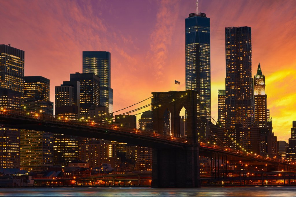 Stock Photos - Brooklyn Bridge with lower Manhattan skyline in New York City at evening