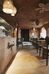 M.Emin BİLİR - A beautifully designed modern café interior featuring stylish lighting and elegant seating.