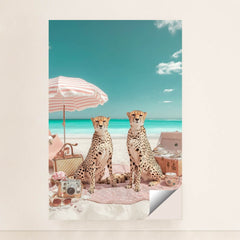 This artwork shows two cheetahs sitting on a pink picnic blanket under a striped umbrella at a bright beach, unframed.