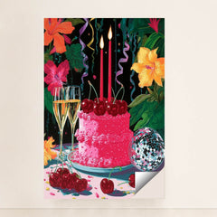 This artwork shows a festive pink cake with cherries, two lit candles, champagne glasses, a disco ball, and colorful hibiscus flowers, minimalist unframed style.