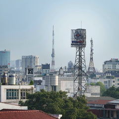 saw sing - Aerial cityscape of Hanoi, Vietnam featuring prominent transmission towers and urban architecture.