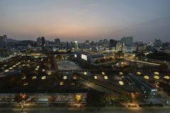 Asia Culture Center - Beautiful aerial view of Gwangju cityscape during twilight with illuminated landmarks and urban architecture.