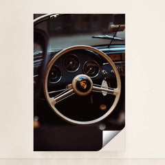 This photo shows the vintage steering wheel and gauges of a classic Porsche car, minimalist unframed style.