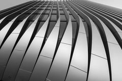 Wolfgang Weiser - Dynamic geometric facade of a contemporary skyscraper in Prague showcasing modern architecture.