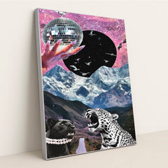 This artwork shows a surreal collage of a jeweled hand holding a disco ball, starry sky, soaring birds, snowy mountains, and two leopards, in a silver frame.