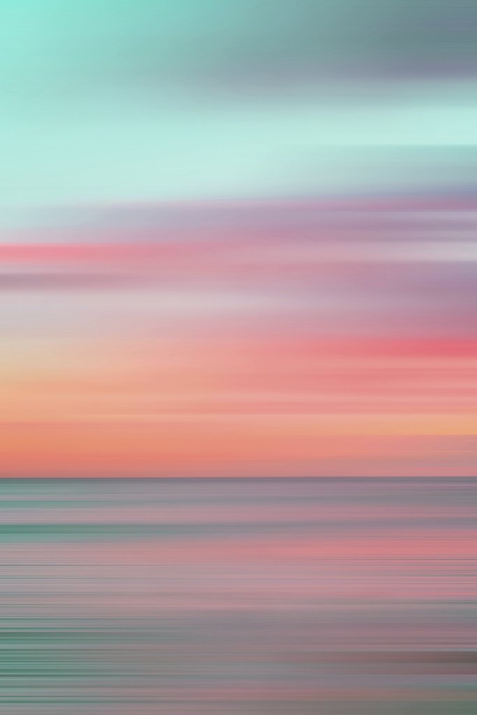 Jess Loiterton - Colorful motion blur capturing a stunning Hawaiian sunset over the ocean.