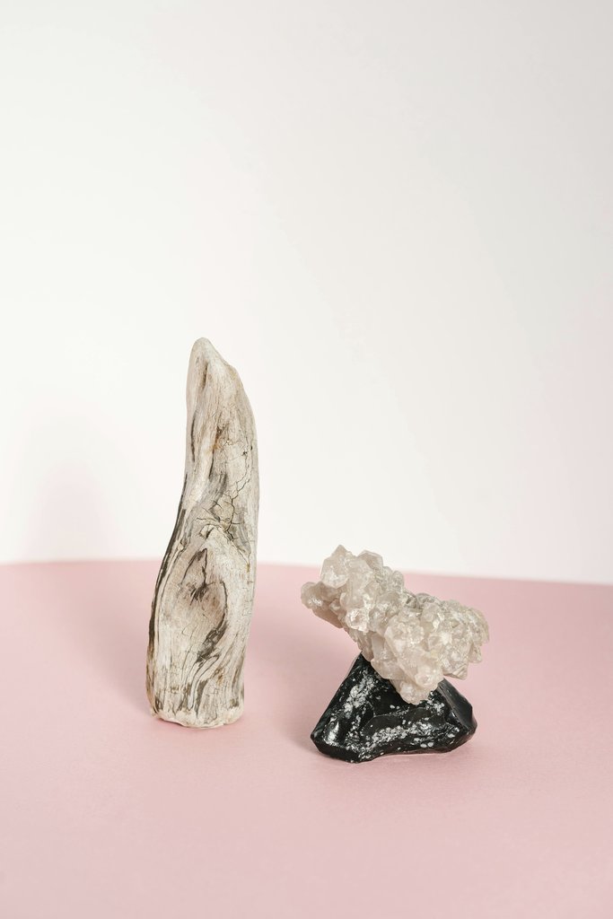 Mikhail Nilov - A minimalist composition featuring crystals and driftwood, perfect for art and decor.