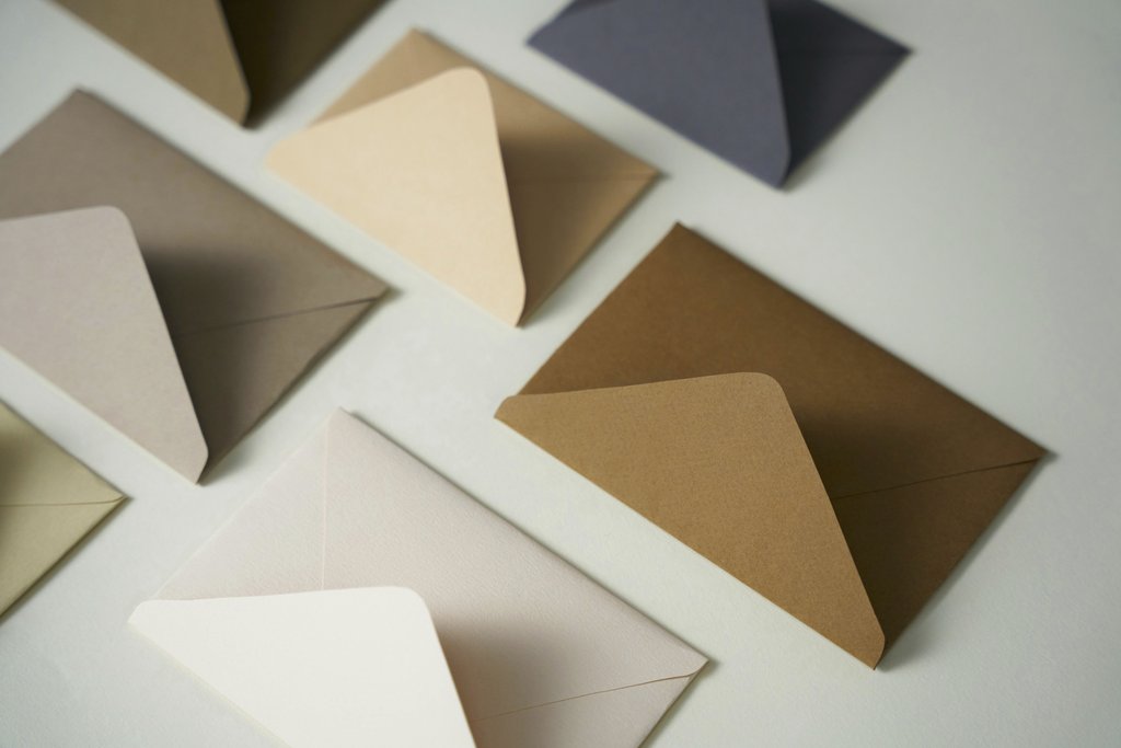 cottonbro studio - A flat lay arrangement of various colored envelopes in a minimalist style, offering diverse stationery options.
