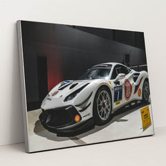This photo shows a white Ferrari 488 Challenge Evo race car with sponsor decals displayed indoors, in a silver frame.