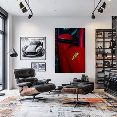 Close-up of a Ferrari in the Rain wall art showcasing its red paint and yellow shield in a modern living room.