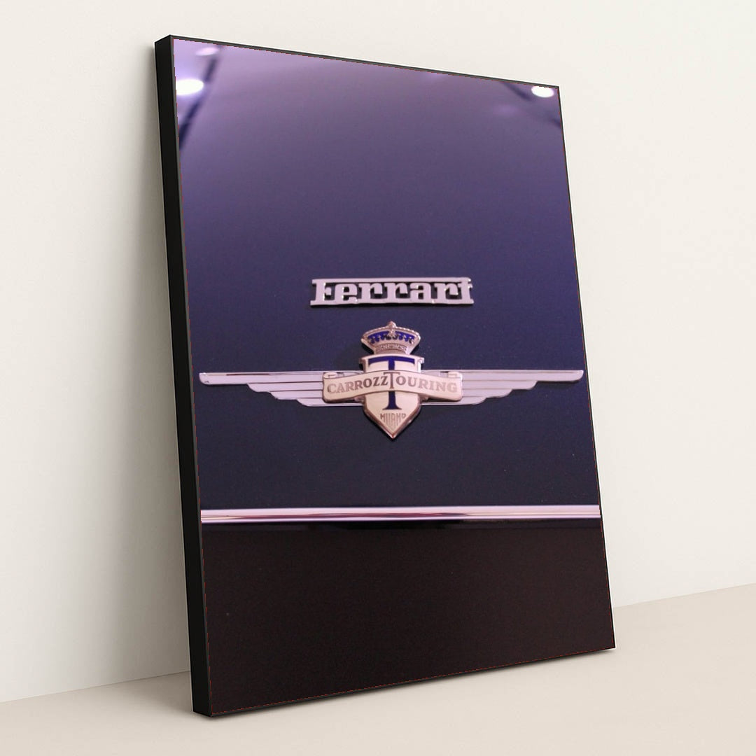 This photo shows a close-up of a classic Ferrari badge and Carrozzeria Touring Milano emblem on a dark car hood, in a black frame.