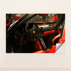This photo shows the black and red leather interior of a Ferrari, featuring a round steering wheel and minimalist dash, minimalist unframed style.