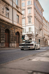 Ferrari Testarossa on Quiet Streets with historic buildings and soft daylight, showcasing car wall art.