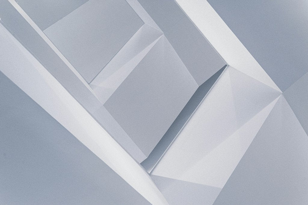 David Yu - Abstract geometric design featuring minimalist shades of blue and grey with sharp angles.