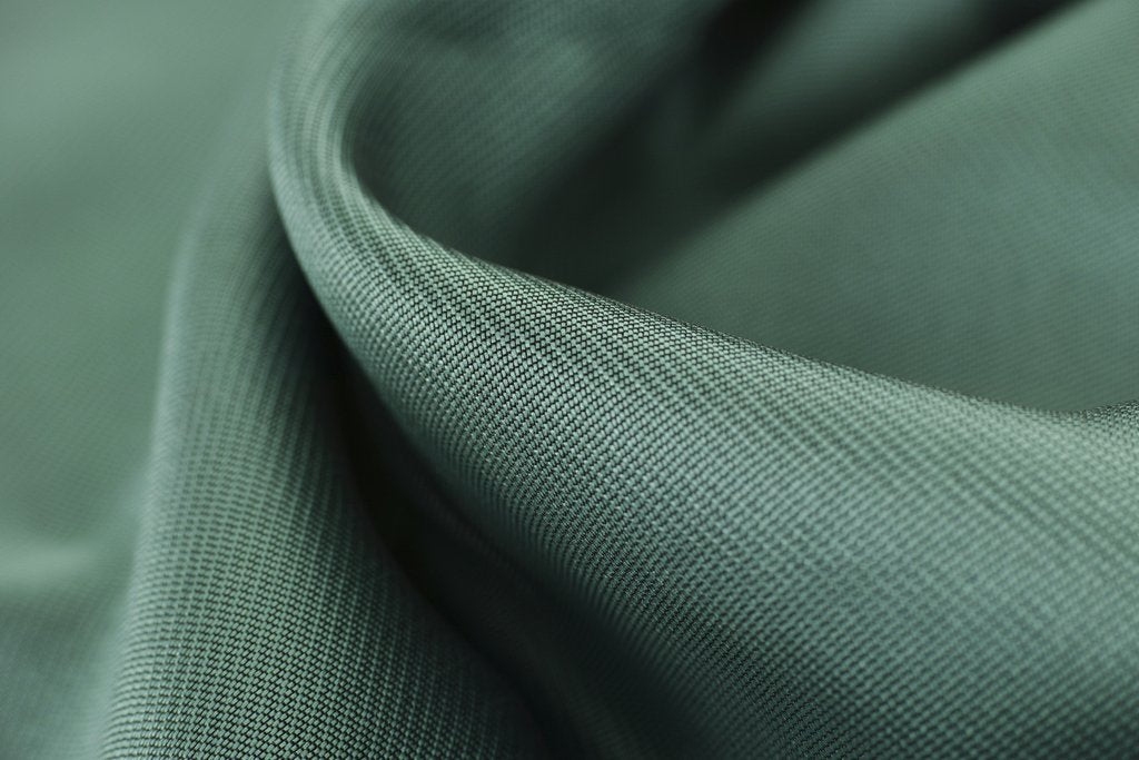 Engin Akyurt - Close-up texture shot of elegant green satin fabric highlighting its smooth and soft surface.