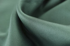 Engin Akyurt - Close-up texture shot of elegant green satin fabric highlighting its smooth and soft surface.