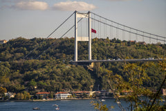 Yasir Gürbüz - View of the Fatih Sultan Mehmet Bridge spanning the Bosphorus in Istanbul, showcasing the lush surrounding landscape.