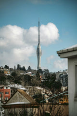 Unknown - View of Camlica Tower rising above a snowy Istanbul neighborhood, showcasing winter architecture.