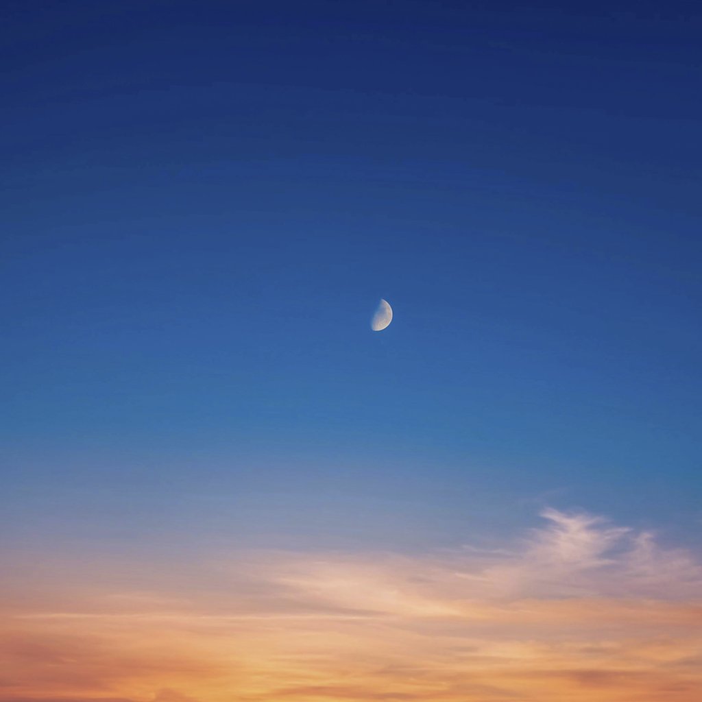 Ayush Mann - A beautiful twilight sky featuring a crescent moon and colorful sunset gradient hues.