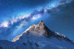 Stock Photos - Milky Way above snowy mountains. Space. Fantastic view with snow covered rocks and starry sky at night in Nepal. Mountain ridge and sky with stars in Himalayas. Landscape with bright milky way. Galaxy