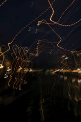 Katia Miasoed - Captivating abstract long exposure of light trails in a dark cityscape at night.