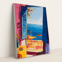 This artwork shows an impressionist-style open blue window with a seaside view, vibrant flowers, and a cozy patio scene, in a silver frame.
