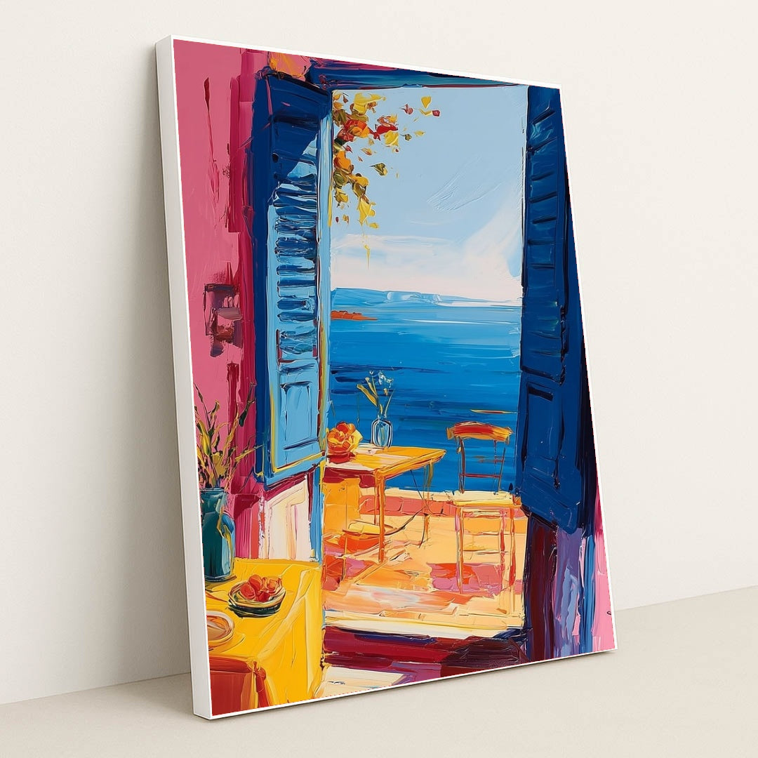 This artwork shows an impressionist-style open blue window with a seaside view, vibrant flowers, and a cozy patio scene, in a white frame.