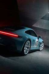 Porsche 911 No. 63 Garage Scene, pastel blue car with LED taillight in a shadowed concrete garage, car wall art.