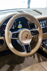 Porsche Tan Luxury Interior featuring a tan leather steering wheel with Porsche crest and modern digital display, car wall art.