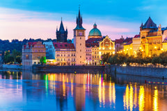 Stock Photos - Scenic summer evening view of the Old Town ancient architecture and Vltava river pier in Prague, Czech Republic