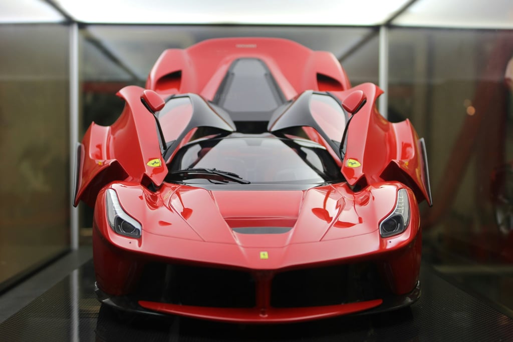 LaFerrari in Full Glory: stunning car wall art showcasing the red Ferrari with butterfly doors open and sleek design.