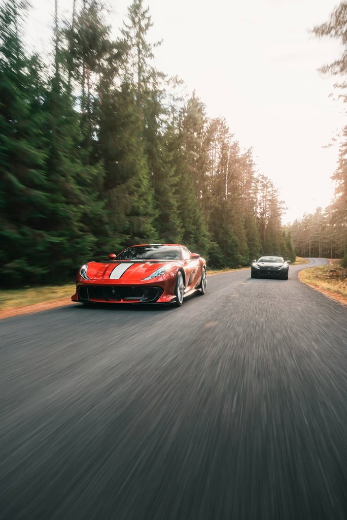 Ferrari 812 Competizione in Action, two Ferrari supercars racing on a forest road, perfect car wall art.
