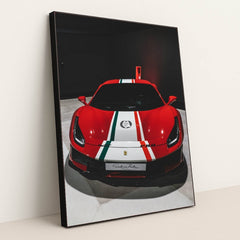 This photo shows the front view of a red Ferrari 488 Pista with Italian flag stripes in an indoor showroom, in a black frame.