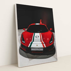 This photo shows the front view of a red Ferrari 488 Pista with Italian flag stripes in an indoor showroom, in a white frame.
