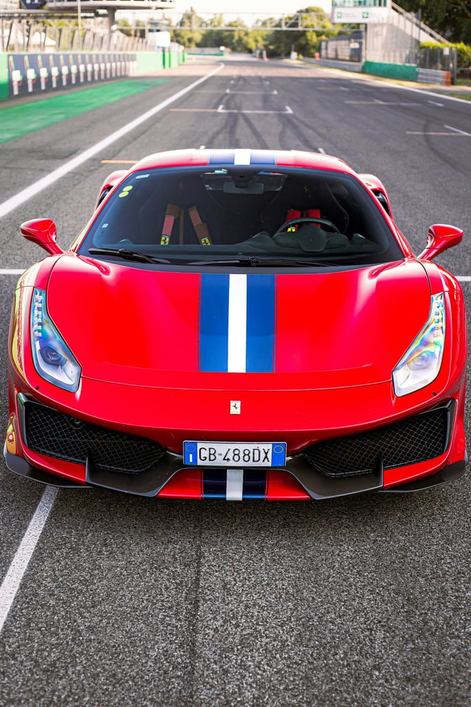 Ferrari 488 Pista on Track with red glossy finish and blue racing stripe, ideal for car wall art.