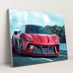 This photo shows a red Ferrari sports car with aggressive styling and carbon fiber accents on a racetrack, in a silver frame.