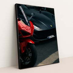 This photo shows a red sport motorcycle next to a matte black Ferrari sports car in a parking area, in a black frame.