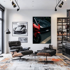 Ferrari vs. Superbike artwork in modern living room, showcasing a red superbike and matte black Ferrari.