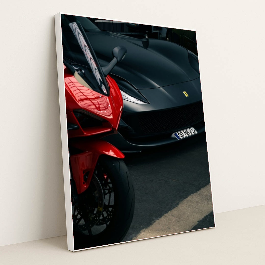 This photo shows a red sport motorcycle next to a matte black Ferrari sports car in a parking area, in a white frame.