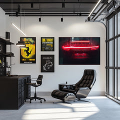 Crimson Porsche 911 in the Rain car wall art displayed in a modern office, illuminated by LED lights.